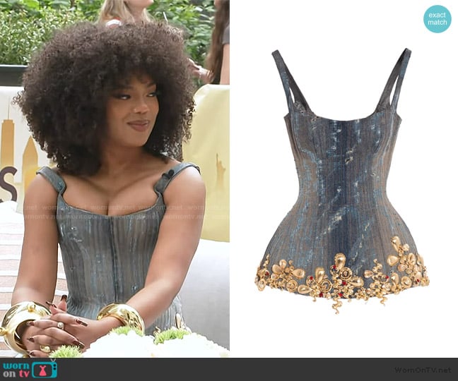 Albina Dyla Golden Bloom Corse worn by Riley Burruss on Access Hollywood