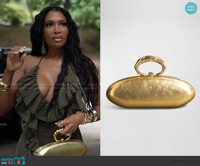 Alexis Bittar Molten Gold Bullet Minaudiere worn by Brit Eady on The Real Housewives of Atlanta