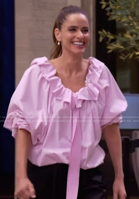 Amanda Peet’s pink ruffle neck blouse on Live with Kelly and Mark