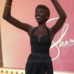 Anok Yai’s black pleated skirt and top on Sherri