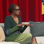 Jacqueline Coley’s green ribbed striped dress on Access Hollywood