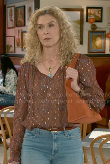 Jan’s printed blouse and orange suede bag on Beyond the Gates