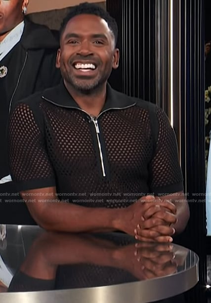 Justin’s black mesh half zip polo on E! News