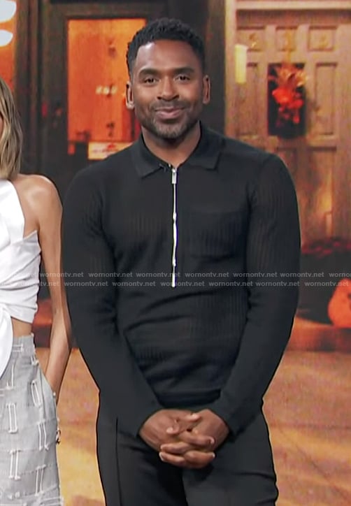 Justin’s black half zip sweater on E! News