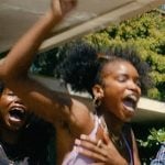 Keisha’s purple floral bikini top and grey shorts on Forever