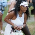 Kelli’s white mesh top and tennis skirt on The Real Housewives of Atlanta