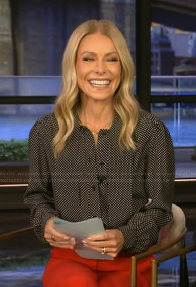 Kelly's black polka dot print tie neck top on Live with Kelly and Mark