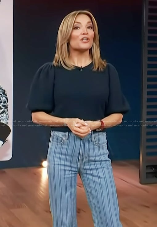 Kit’s navy puff sleeve top and striped jeans on Access Hollywood