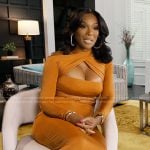 Angela’s orange cutout confessional dress on The Real Housewives of Atlanta