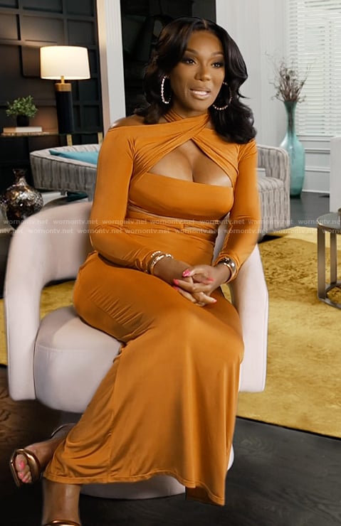 Angela’s orange cutout confessional dress on The Real Housewives of Atlanta