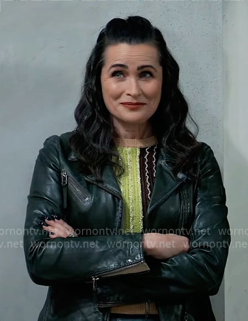 Lois’s metallic colorblock knit top and leather jacket on General Hospital