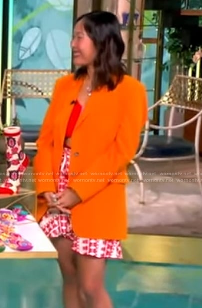 Mary Gui’s orange blazer and printed mini skirt on The View