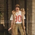Maya’s beige puffer long vest and jeans on The Studio