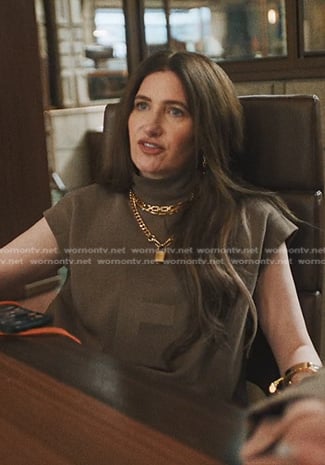 Maya's brown mock neck top on The Studio