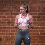 Mikaela Shiffrin’s white sports bra and leggings on The Voice