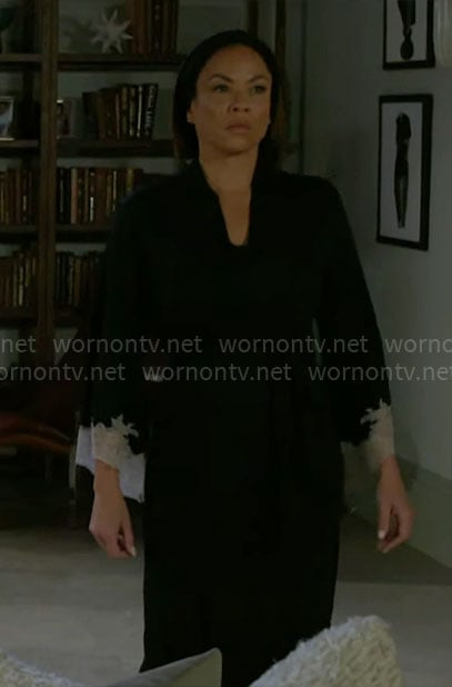 Nicole's black robe with white lace trims on Beyond the Gates