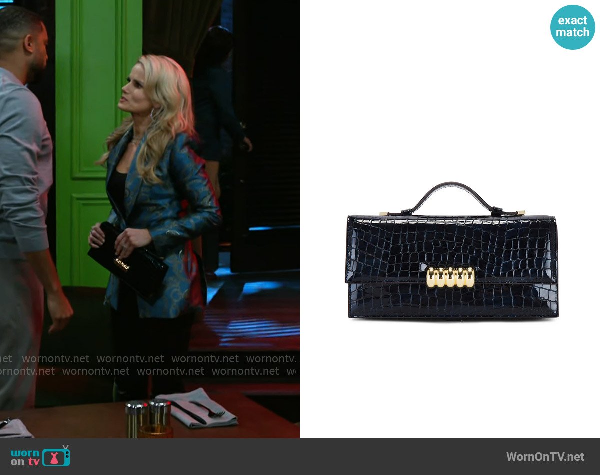 Retrofete Phoebe Clutch worn by Vanessa McBride (Lauren Buglioli) on Beyond the Gates