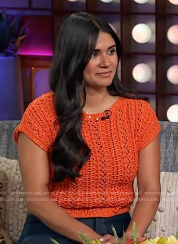 Sam’s orange knit top on The Kelly Clarkson Show