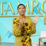 Tamron’s yellow floral print drape wrap top and skirt on Tamron Hall Show