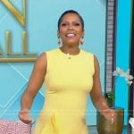 Tamron’s yellow ruffle mini dress on Tamron Hall Show