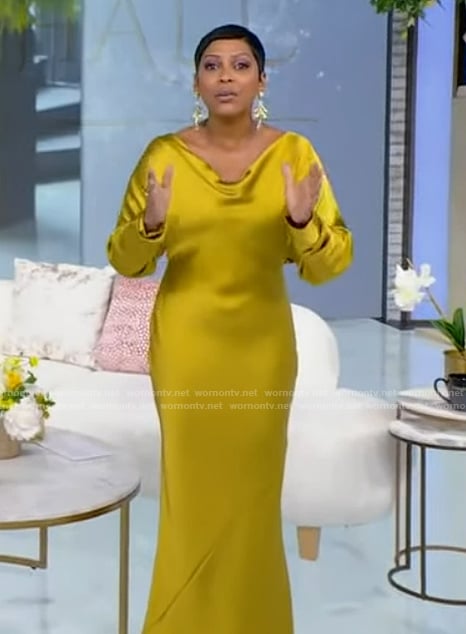 Tamron’s yellow satin cowl neck dress on Tamron Hall Show