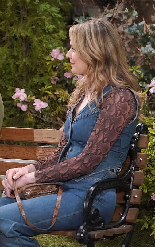 Tessa's snake print top and braided denim vest on The Young and the Restless