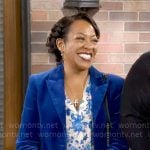 Tina’s blue velvet suit and floral blouse on The Neighborhood