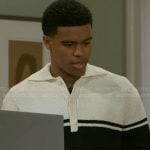 Tyrell’s cream and black striped polo sweater on Beyond the Gates
