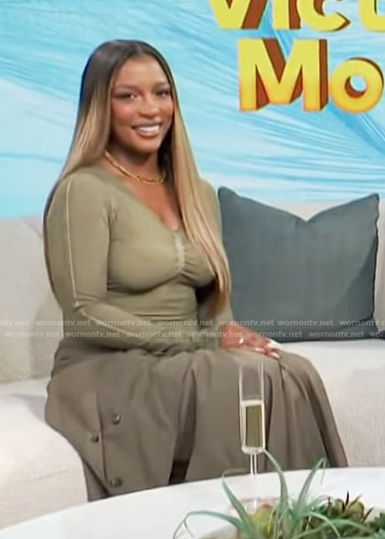 Victoria Monet’s khaki top and skirt on Access Hollywood