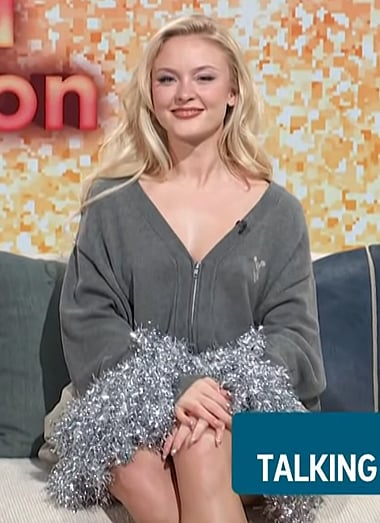 Zara Larsson’s gray tinsel cuff sweater on Access Hollywood