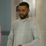 Andre’s grey laddered sweater on Beyond the Gates