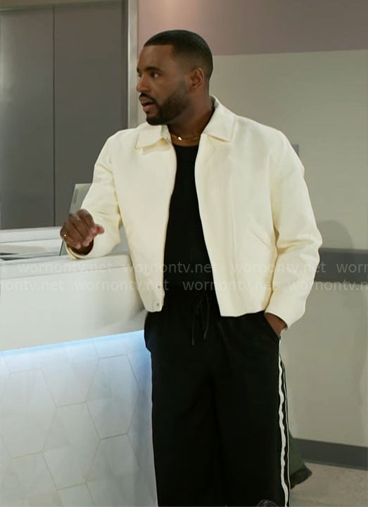 Andre's off white jacket and side-stripe pants on Beyond the Gates