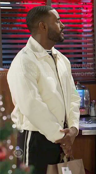 Andre's off white jacket and side-stripe pants on Beyond the Gates