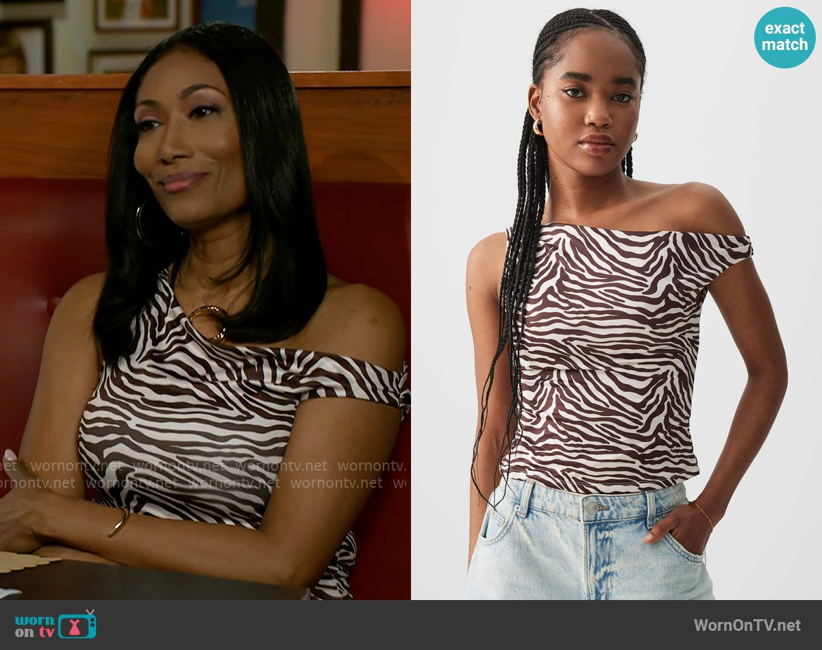 Ardene Zebra Print Single Shoulder Top worn by Dana 'Leslie' Thomas (Trisha Mann-Grant) on Beyond the Gates