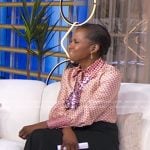 Deborah’s orange mixed print tie neck blouse on Good Morning America