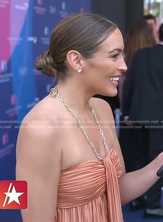 Emily’s coral pleated dress with chain strap on Access Hollywood