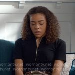 Ginny’s black zip polo top and green pleated shorts on Ginny & Georgia
