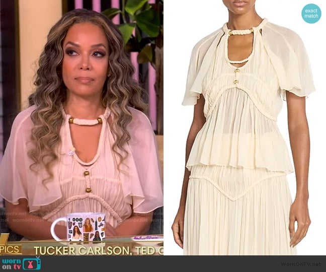 Sunny’s ivory sheer blouse on The View