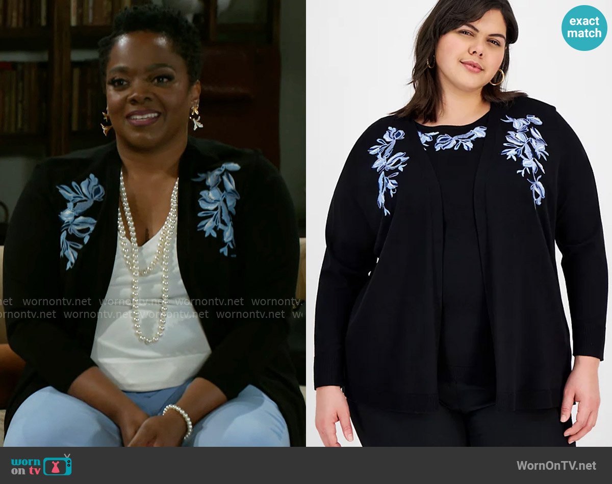 Mona’s black and blue floral cardigan on Beyond the Gates
