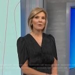 Kate’s black gathered top and pleated skirt on NBC News Daily
