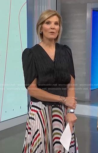Kate's black gathered top and pleated skirt on NBC News Daily