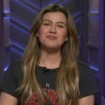 Kelly’s black Mysterious Force graphic tee on The Kelly Clarkson Show