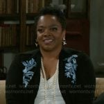 Mona’s black and blue floral cardigan on Beyond the Gates