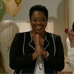 Mona’s black jacket with white trims on Beyond the Gates