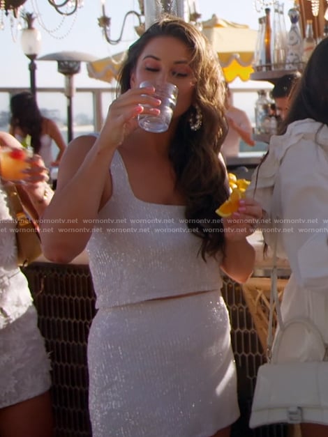 Nia’s white sequin top and mini skirt on The Valley