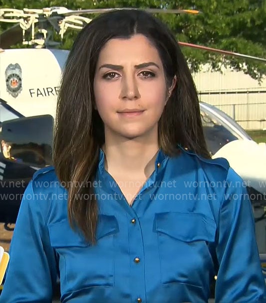 Nicole Sganga’s blue satin shirt on CBS Mornings