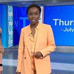 Zinhle’s orange blazer and wide leg pants on NBC News Daily