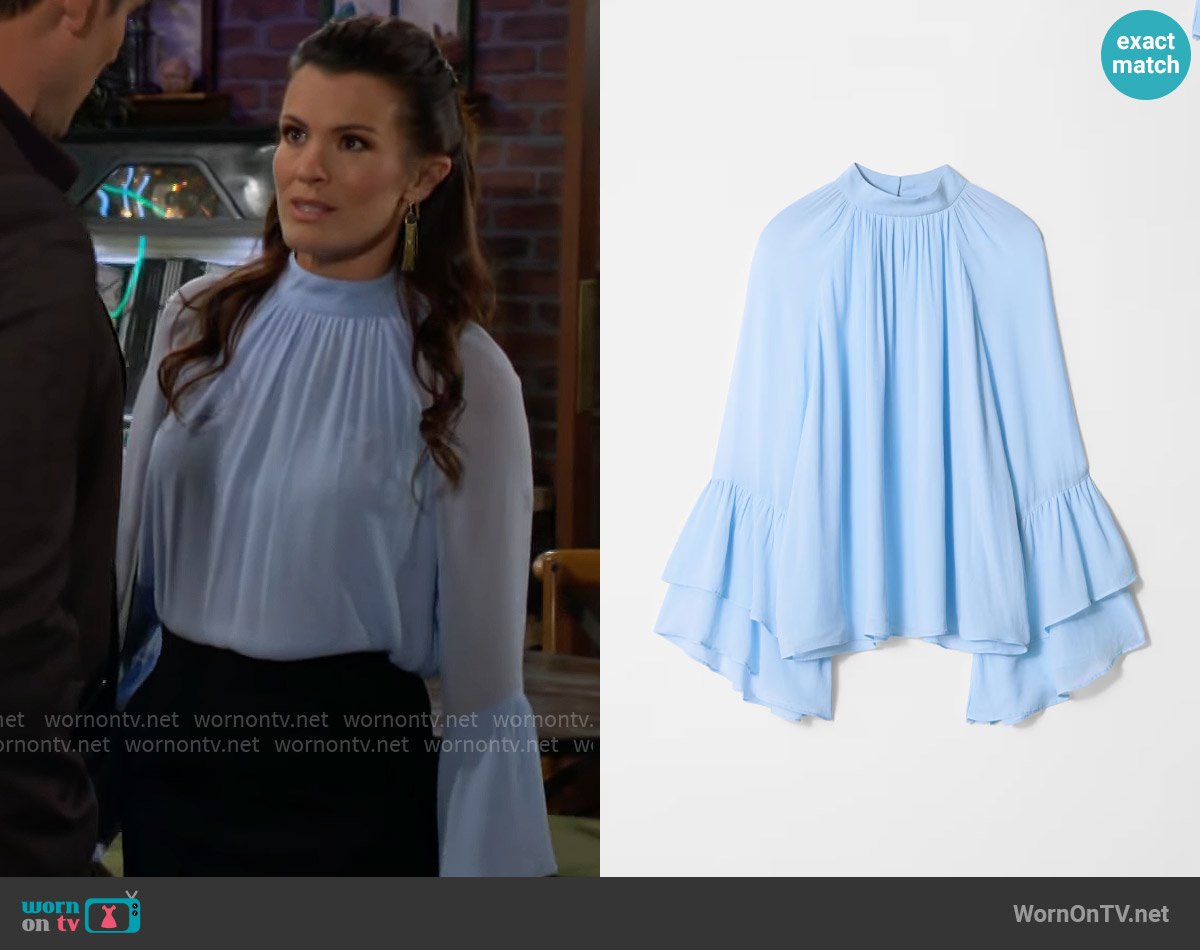 & Other Stories Flounced Stand-Collar Blouse in Light Blue worn by Chelsea Lawson (Melissa Claire Egan) on The Young and the Restless
