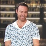 Paul Zahn’s blue geometric print polo on Access Hollywood