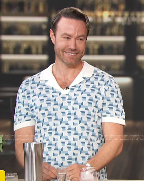 Paul Zahn’s blue geometric print polo on Access Hollywood